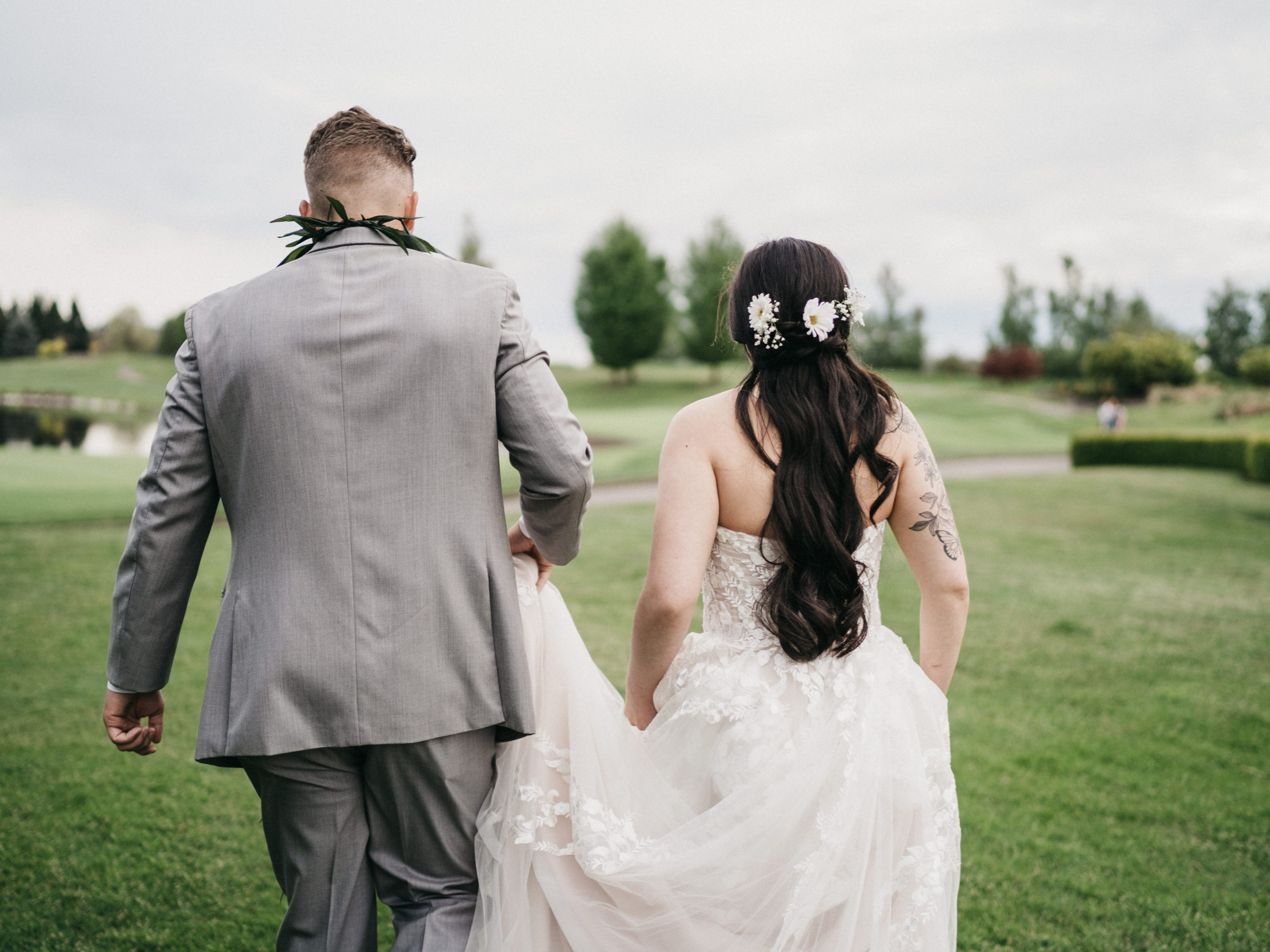 A bride with Professionally-done hair services by Blushing Flower Events
